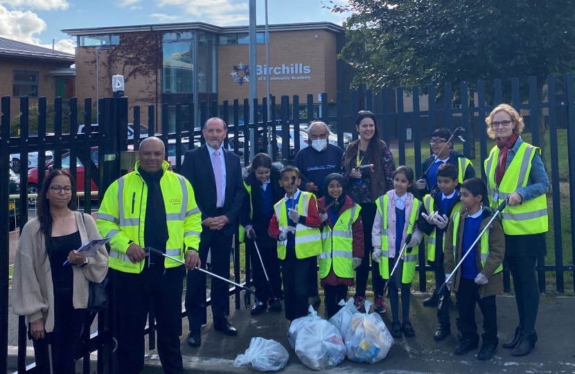 Eddie litter picking with the pupils from the school