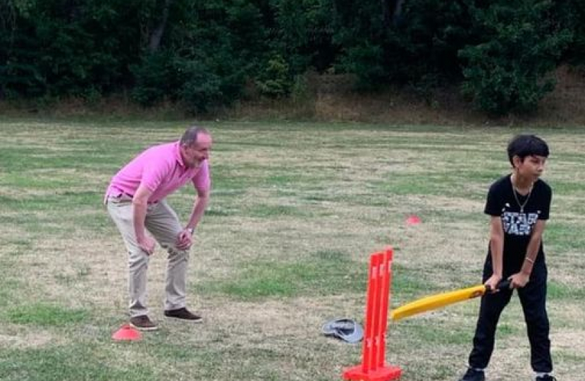 Eddie as the wicket keeper in a game of cricket